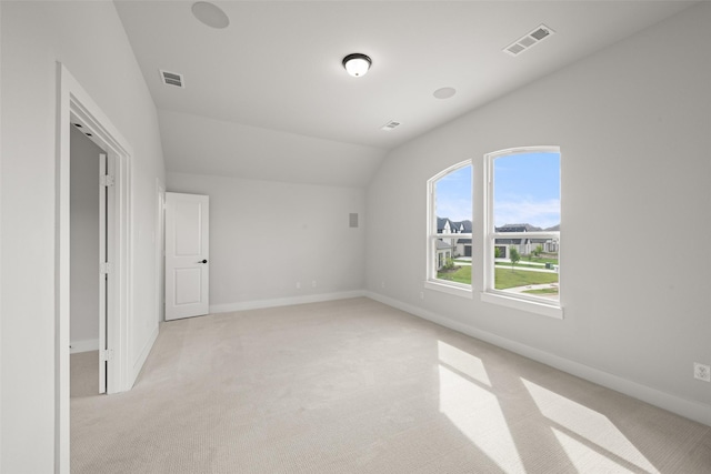 7127 Seagrove Ct, Grand Prairie, TX 75054 - spare room with light carpet and lofted ceiling