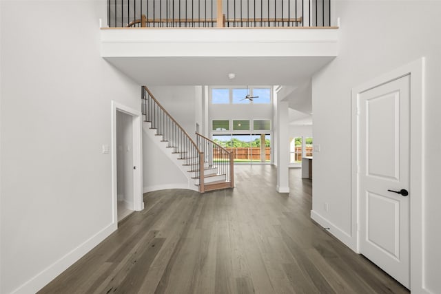 7127 Seagrove Ct, Grand Prairie, TX 75054 - foyer featuring a high ceiling, stairway, ceiling fan, and wood finished floors