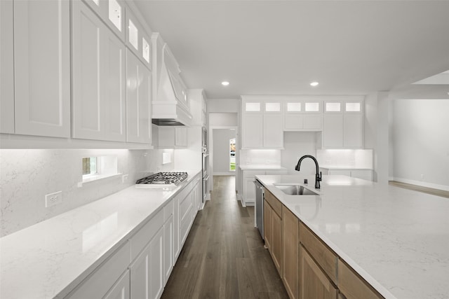 7127 Seagrove Ct, Grand Prairie, TX 75054 - kitchen with stainless steel gas cooktop, dark wood-style flooring, recessed lighting, backsplash, and light stone countertops
