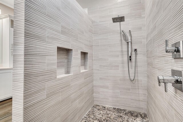 bathroom with a tile shower