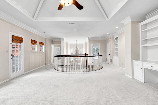 hall with built in features, baseboards, visible vents, light carpet, and crown molding