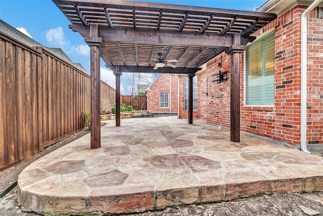 view of patio with ceiling fan, a fenced backyard, and a pergola