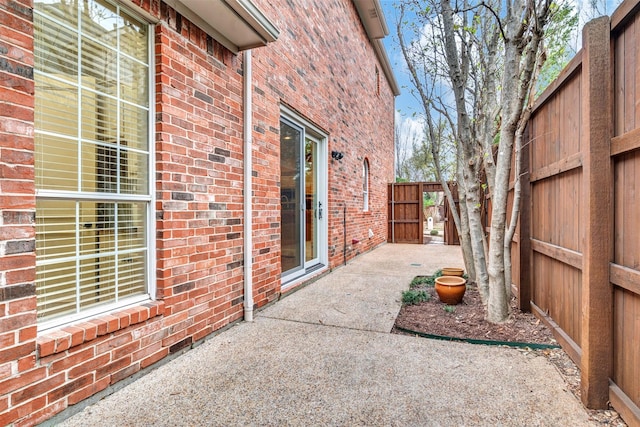 view of patio / terrace featuring fence