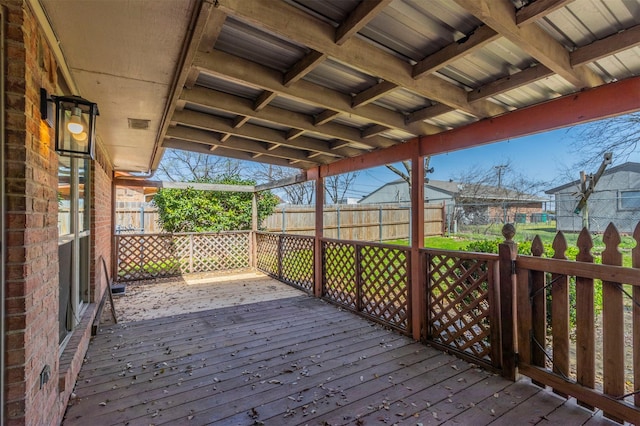 wooden deck featuring a fenced backyard