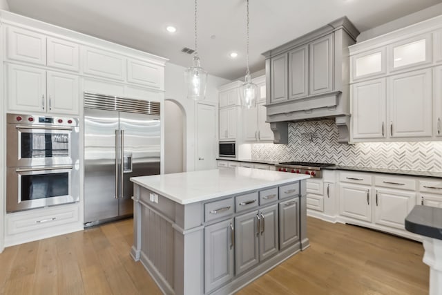 3668 Torrance Blvd, Frisco, TX 75034 - kitchen with a sink, built in appliances, backsplash, and decorative light fixtures
