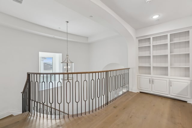3668 Torrance Blvd, Frisco, TX 75034 - hall with an inviting chandelier, baseboards, an upstairs landing, wood finished floors, and visible vents