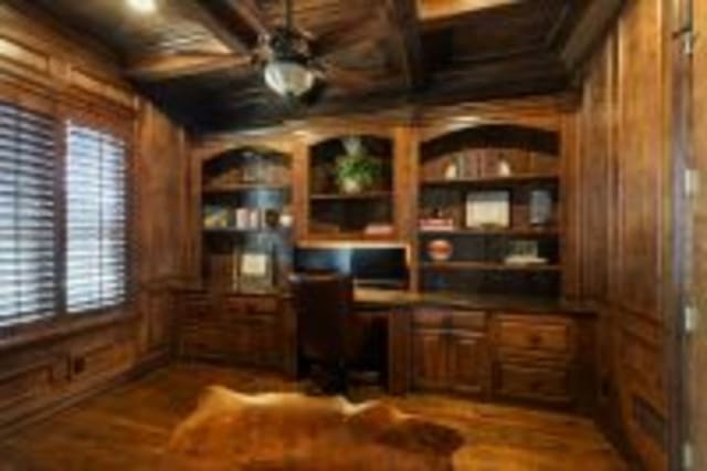 156 Stoneleigh Dr, Heath, TX 75032 - office area with wood walls, built in desk, a ceiling fan, beamed ceiling, and built in features