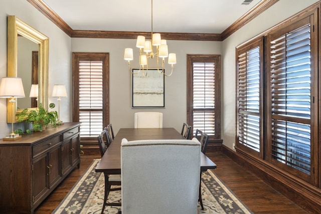156 Stoneleigh Dr, Heath, TX 75032 - dining area featuring dark wood-style flooring, a chandelier, crown molding, and baseboards
