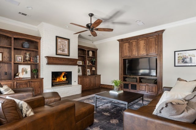 156 Stoneleigh Dr, Heath, TX 75032 - living room featuring ceiling fan, dark wood-style floors, a brick fireplace, crown molding, and baseboards