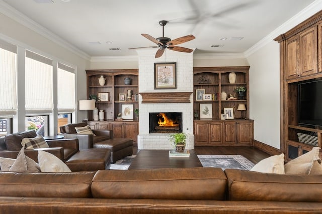 156 Stoneleigh Dr, Heath, TX 75032 - living area with ceiling fan, dark wood-type flooring, a fireplace, crown molding, and baseboards