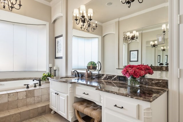 156 Stoneleigh Dr, Heath, TX 75032 - bathroom with a chandelier, ornamental molding, vanity, and a garden tub