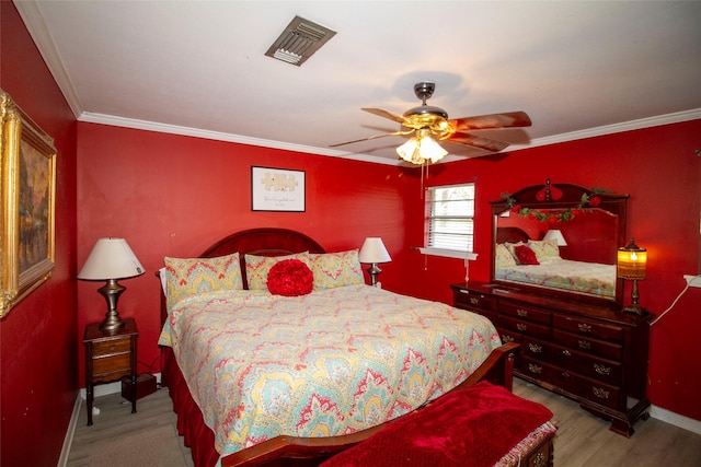 9613 Royalton Dr, Shreveport, LA 71118 - bedroom with visible vents, crown molding, baseboards, wood finished floors, and a ceiling fan