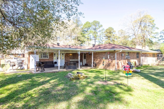 9613 Royalton Dr, Shreveport, LA 71118 - back of house with a yard, a patio, brick siding, and fence