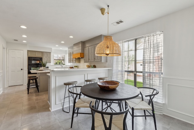 dining room with light tile patterned floors, recessed lighting, and visible vents