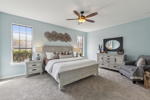 bedroom featuring baseboards, a ceiling fan, and carpet