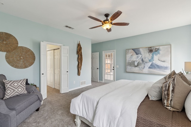 carpeted bedroom with a ceiling fan, baseboards, and visible vents