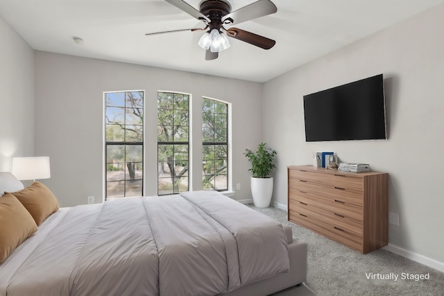 bedroom with baseboards, carpet floors, and ceiling fan