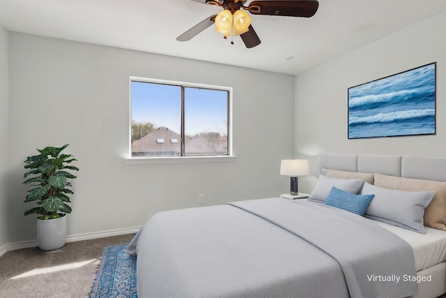 bedroom featuring baseboards, carpet floors, and ceiling fan