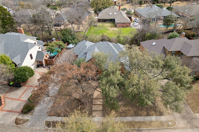 birds eye view of property with a residential view