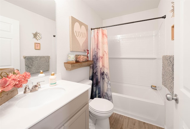 full bath featuring wood finished floors, toilet, shower / tub combo with curtain, and vanity