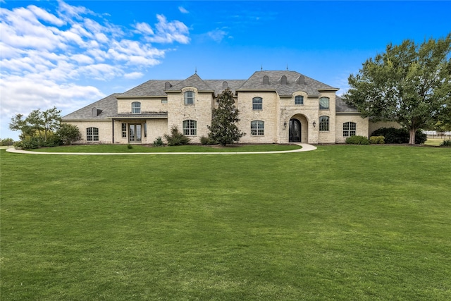 2933 N Star Dr, Celina, TX 75009 - french country inspired facade featuring a front yard, brick siding, and stone siding