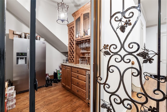 2933 N Star Dr, Celina, TX 75009 - wine area featuring light wood finished floors and a bar