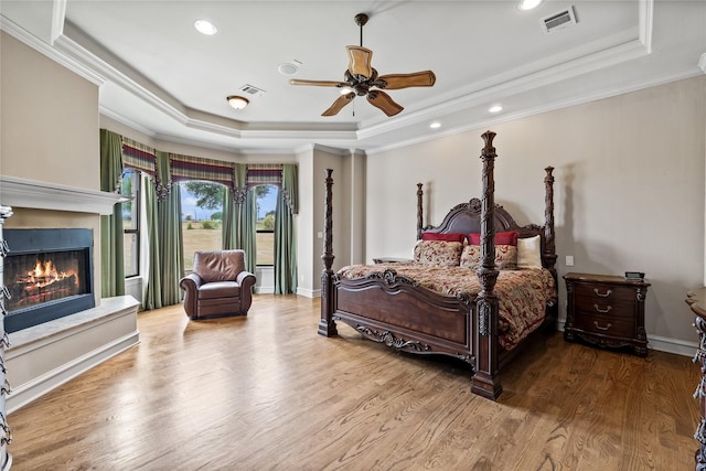 2933 N Star Dr, Celina, TX 75009 - bedroom featuring a raised ceiling, wood finished floors, and visible vents