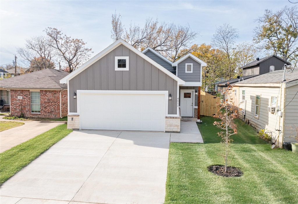 4011 Puget St, Dallas, TX 75212 - view of front of home featuring board and batten siding, a garage, driveway, and brick siding