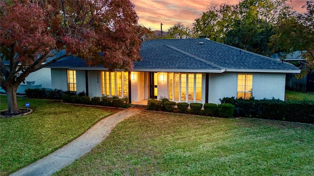 11038 Carissa Dr, Dallas, TX 75218 - ranch-style house with brick siding, a shingled roof, and a front yard