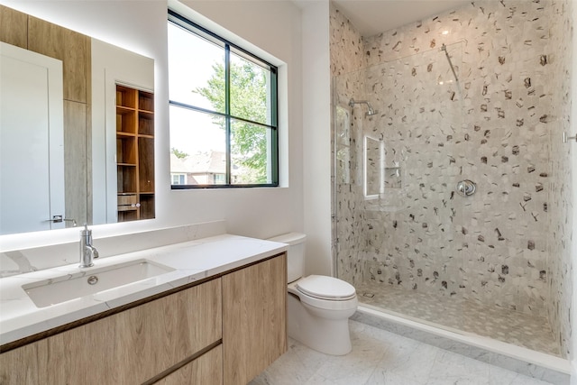 4910 W Hanover Ave, Dallas, TX 75209 - full bath featuring toilet, a tile shower, and vanity