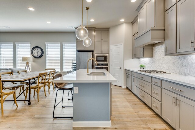 3136 Brazoria Dr, Little Elm, TX 75068 - kitchen with recessed lighting, gray cabinetry, a sink, light countertops, and appliances with stainless steel finishes
