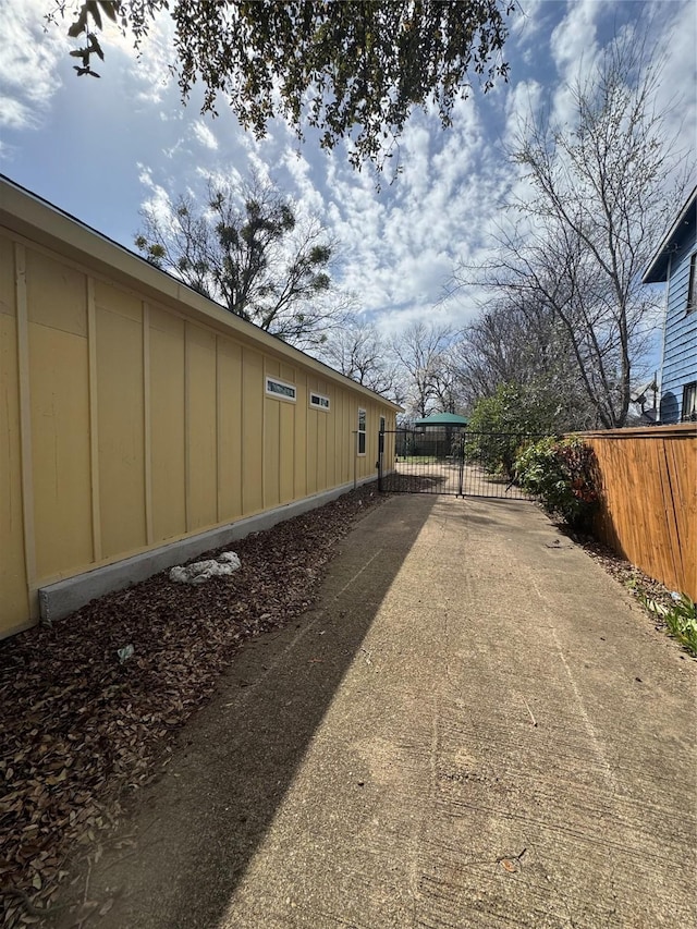 3023 Arizona, Dallas, TX 75216 - view of street featuring a gated entry, concrete driveway, and a gate