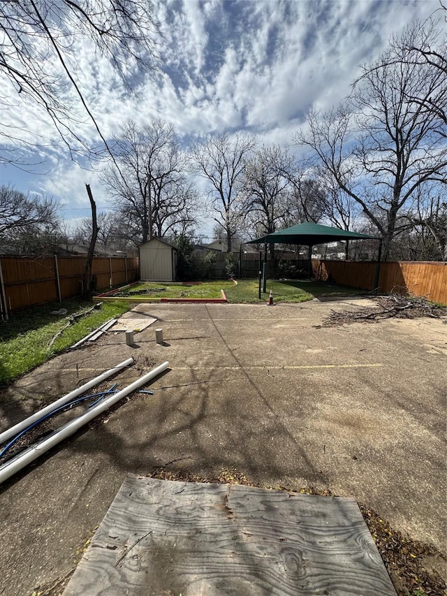 3023 Arizona, Dallas, TX 75216 - view of yard featuring an outbuilding, a storage unit, and a fenced backyard
