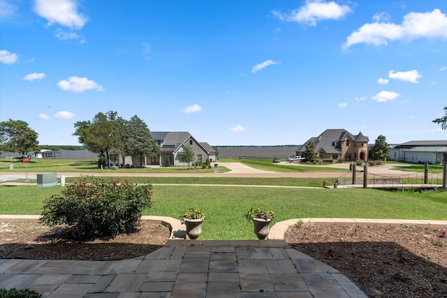 view of property's community featuring a yard