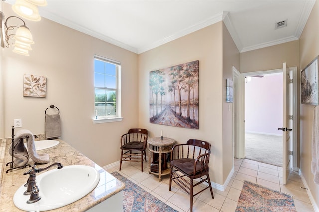 bathroom with tile patterned flooring, visible vents, crown molding, and a sink