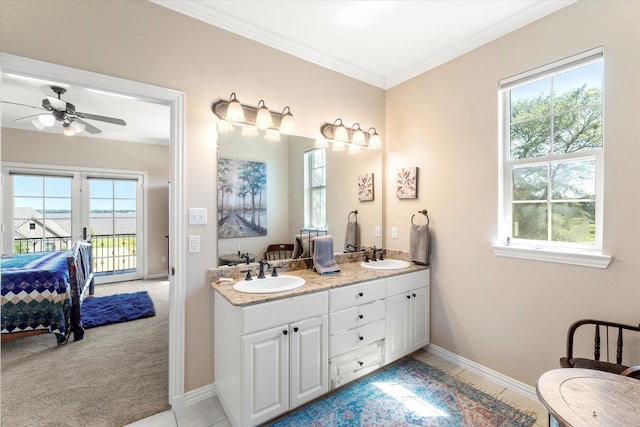 full bathroom featuring a sink, a wealth of natural light, ensuite bathroom, and crown molding
