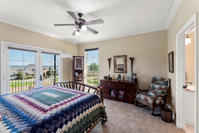 bedroom featuring a ceiling fan, baseboards, light carpet, crown molding, and access to outside
