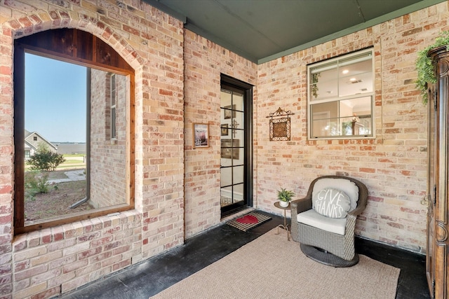 property entrance with brick siding