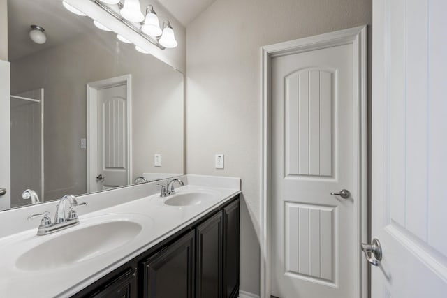 bathroom featuring double vanity and a sink