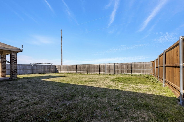 view of yard featuring a fenced backyard