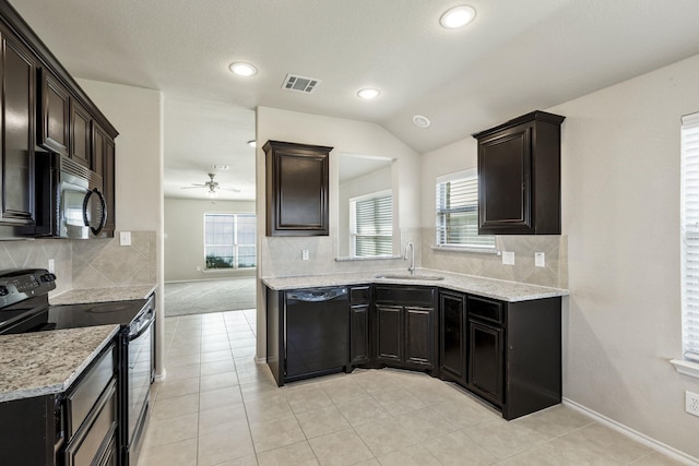 kitchen featuring plenty of natural light, visible vents, a sink, black appliances, and ceiling fan