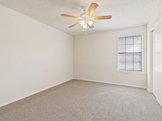 218 N Texas Blvd Unit 316, Denton, TX 76201 - carpeted spare room with baseboards, a textured ceiling, and ceiling fan