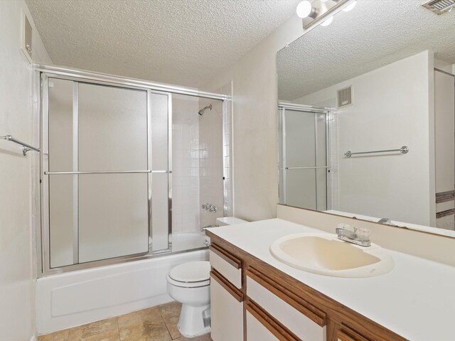218 N Texas Blvd Unit 316, Denton, TX 76201 - bathroom featuring visible vents, toilet, vanity, and a textured ceiling