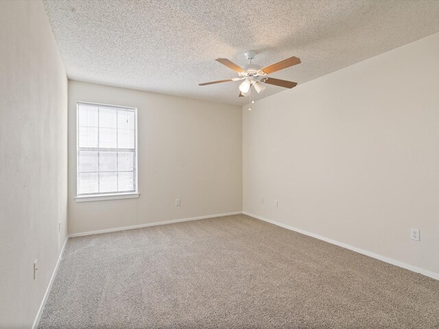 218 N Texas Blvd Unit 316, Denton, TX 76201 - carpeted spare room featuring baseboards, a textured ceiling, and ceiling fan
