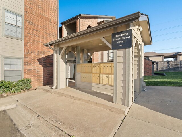 218 N Texas Blvd Unit 316, Denton, TX 76201 - exterior space featuring brick siding and fence