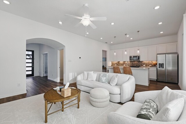 1417 Horizon Way, Northlake, TX 76247 - living area with a ceiling fan, recessed lighting, baseboards, dark wood finished floors, and arched walkways