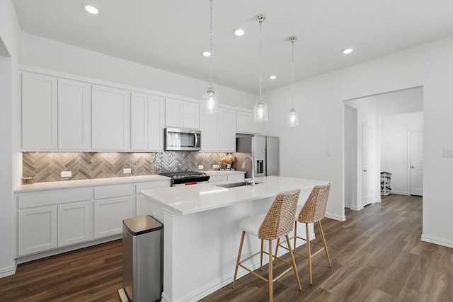 1417 Horizon Way, Northlake, TX 76247 - kitchen featuring recessed lighting, decorative backsplash, a center island with sink, light countertops, and appliances with stainless steel finishes