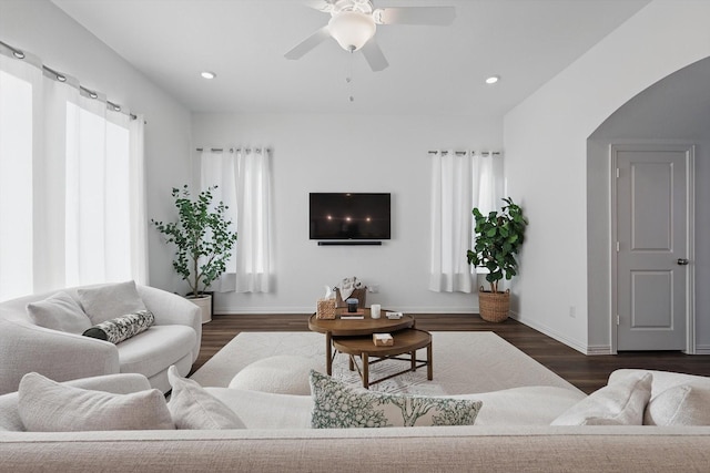 1417 Horizon Way, Northlake, TX 76247 - living room with ceiling fan, arched walkways, baseboards, and dark wood finished floors