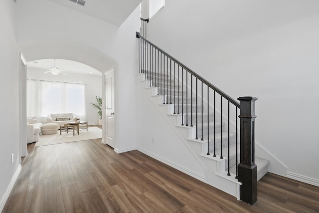 1417 Horizon Way, Northlake, TX 76247 - stairway with a high ceiling, arched walkways, baseboards, and wood finished floors