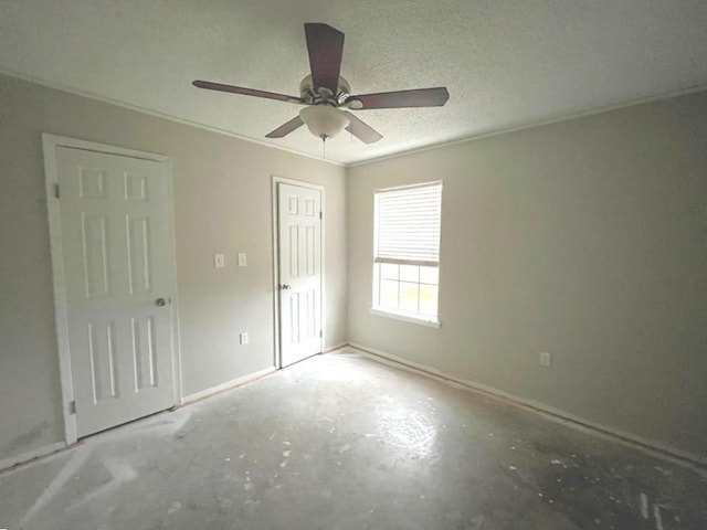 unfurnished bedroom featuring a textured ceiling, concrete flooring, ceiling fan, and crown molding